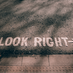 Image: Road markings which say 'Look Right'